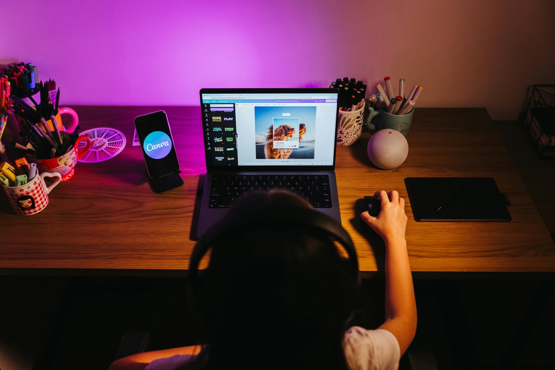 Person using Canva on a laptop