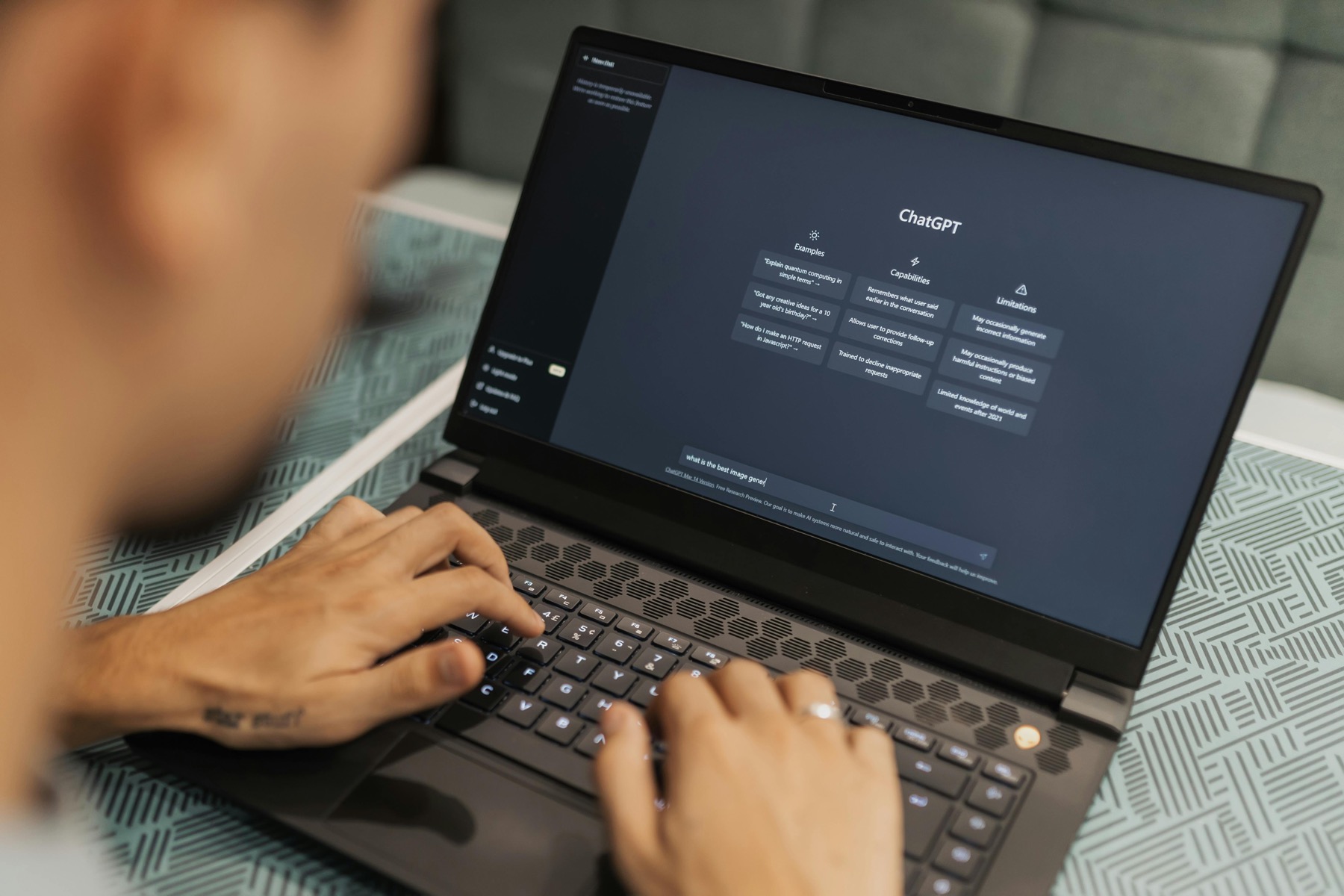 Person using ChatGPT on a laptop